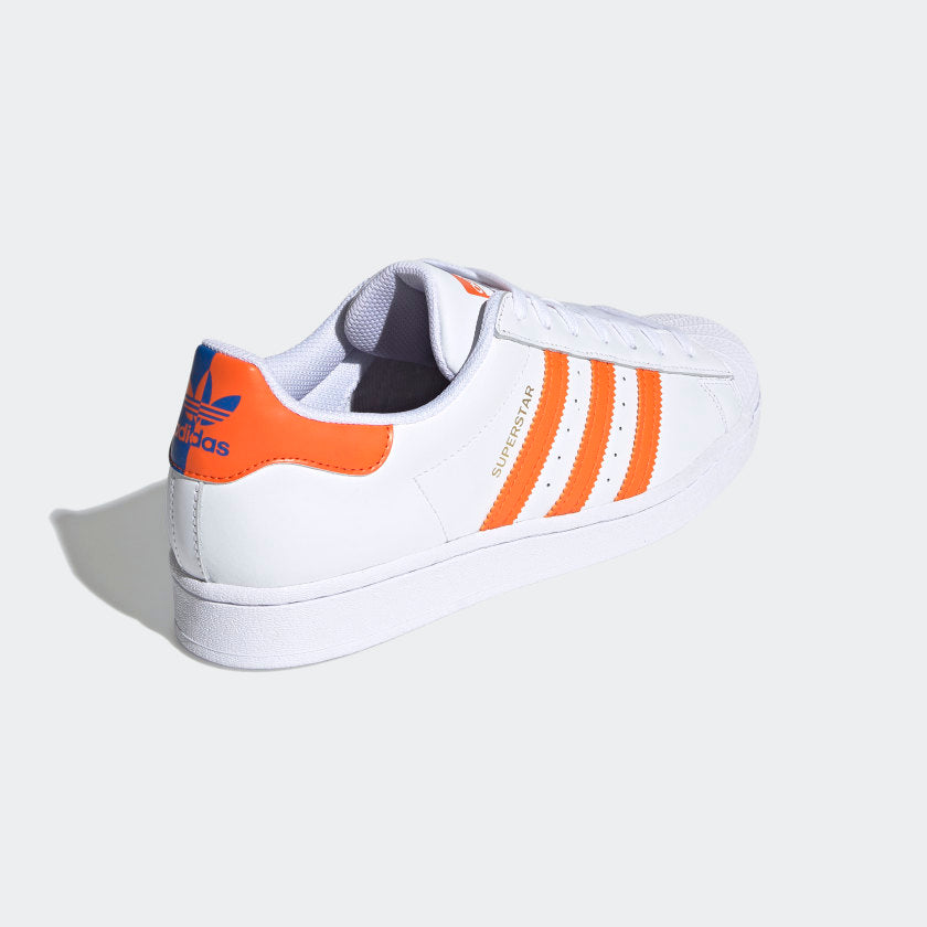 orange and white adidas superstar